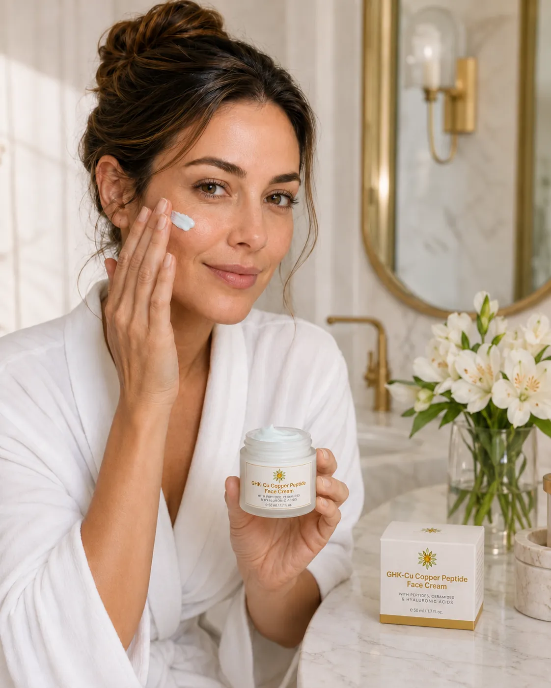 Model applying Gilded GHK-Cu Face Cream while holding the open jar beside the product box