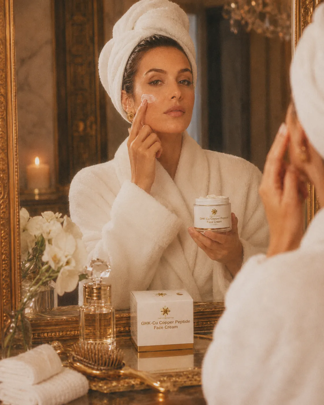 Model applying Gilded GHK-Cu Face Cream at a warm bathroom mirror with the open jar and product box