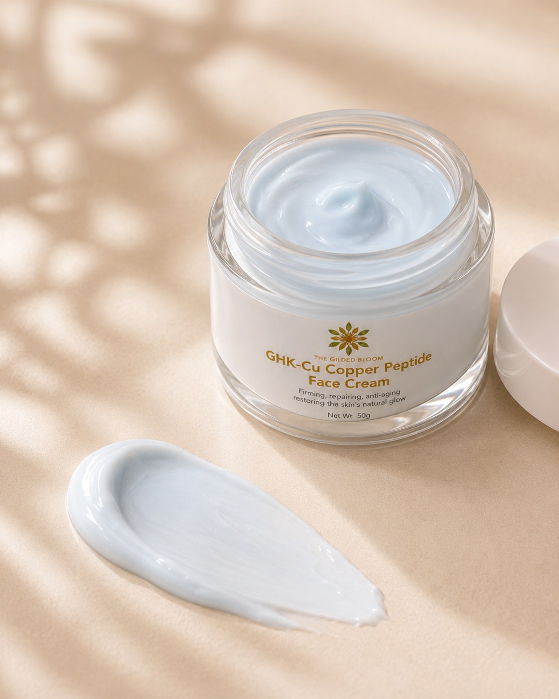 Open Gilded GHK-Cu Face Cream jar with blue cream texture swatch